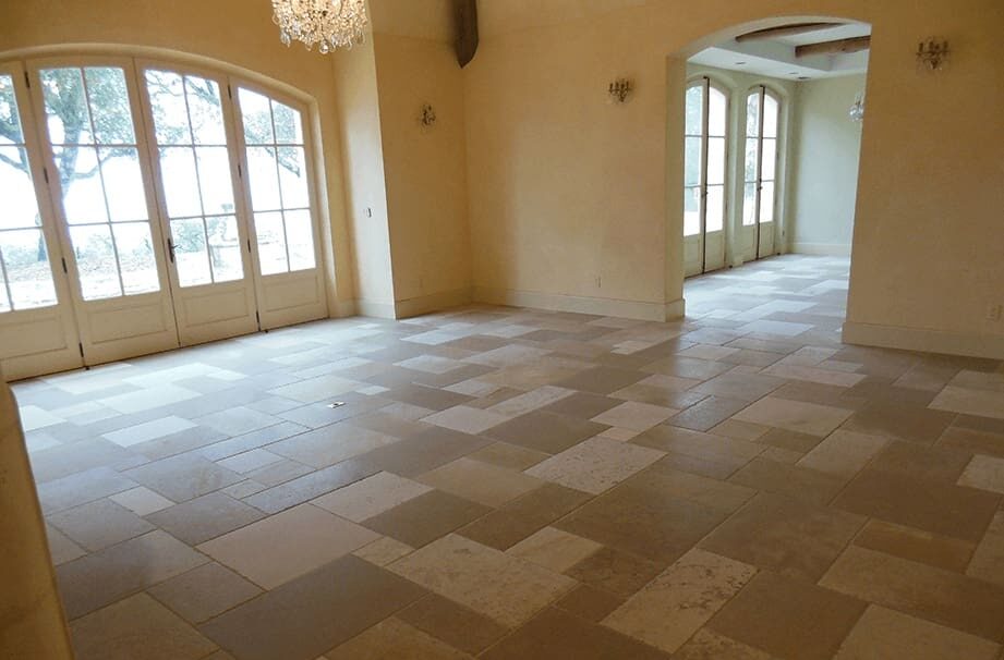 A room with tile floors and white walls.