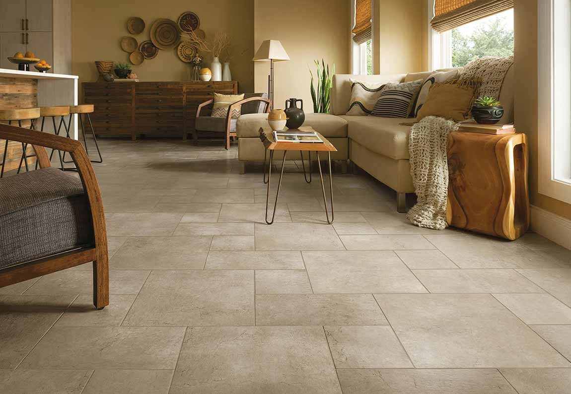 TravertineTile A living room with beige furniture and tan walls.