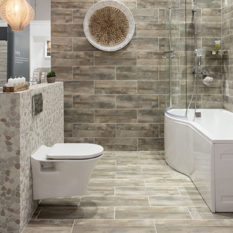 BrownStoneBathroom-6067941 A bathroom with a toilet, tub and shower.